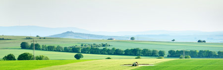 Picturesque panoramic view of the countryside agricultural field. Idyllic rural scene. Platz, Germany. Ecology. alternative production, farm, food industry, environmental damage and conservationの写真素材