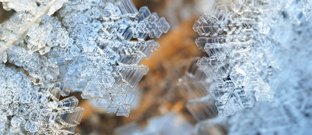 Snow crystals, close-up. Clear water. Panoramic image. Abstract natural pattern, texture, background, wallpaper, graphic resources. Seasons, climate change, cold temperature, environmentの写真素材