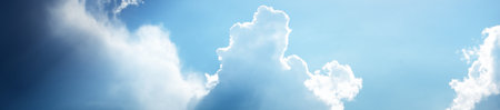 Clear blue sky with glowing white cirrus and cumulus clouds. Panoramic dramatic cloudscape. Concept...