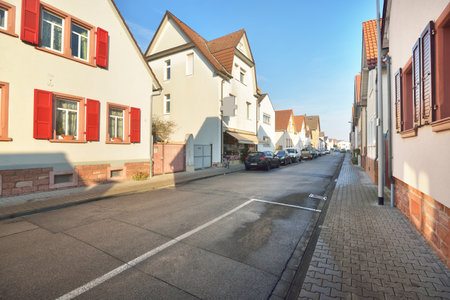 An empty street through the old traditional houses. People are staying home because of travel ban and coronavirus (COVID-19) outbreak. Quarantine zone in Mainz, Rheinland-Pfalz, Germanyの写真素材