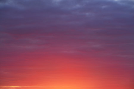 Clear sky with glowing pink and red clouds after storm at sunset. Dramatic cloudscape. Concept art,...