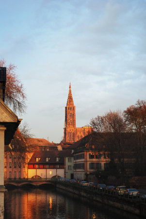 Strasbourg Cathedral, panoramic view from the canal promenade in old town. France. Travel destinations, landmarks, sightseeing, history, culture, architecture. No people because of COVID-19 outbreakの写真素材