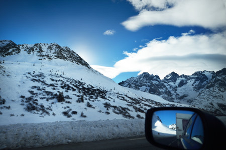 An empty highway in a French Alps mountains. A view from the car stucked near the border of Italy because of travel ban. Coronavirus (COVID-19) outbreak, quarantine zone in Parc Ecrins, Franceの写真素材