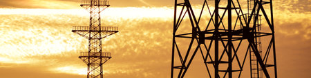 Electricity line against clear golden sunset sky, close-up. Concept urban landscape. Energy, power generation, equipment, industry, environmental damage, ecology, ecological issues, infrastructureの写真素材