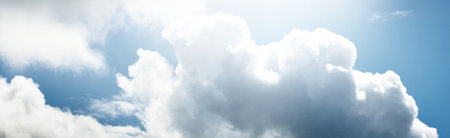 Clear blue sky with glowing cumulus clouds after the storm. Dramatic cloudscape. Concept art,...
