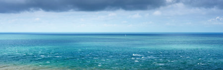 View from the coast of Cap Gris Nez, France. Azure water, waves, water splashes. Dramatic sky....