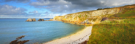 Panoramic aerial view of an ocean lagoon at Pointe de Toulinguet in Brittany, France. Dramatic sky, shore (cliffs) close-up. Idyllic landscape. Travel destinations, landmarks, sightseeing, tourismの写真素材