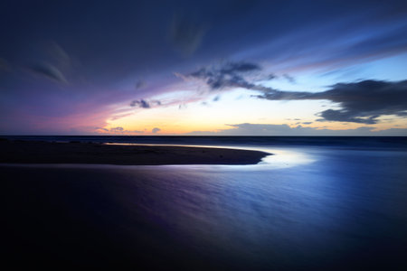 Stunning sunset sky above the Baltic Sea, Denmark. Storm waves and colorful clouds. Long exposure