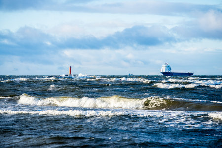 Lighthouse against stormy blue sky. Baltic sea, Latviaの写真素材