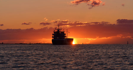 Cargo ship in the Baltic sea at sunset. Latviaの写真素材