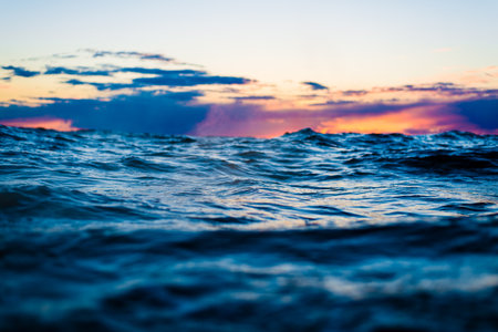 Colorful sunset sky above the North sea, Norway. Waves and cloudsの写真素材