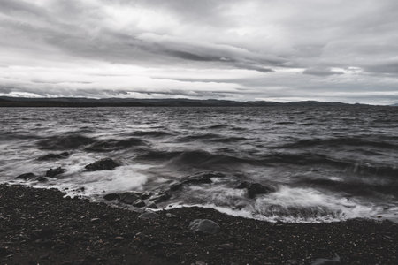 Rocky shores, cliffs, mountain peaks, woodland and hills of Crinan, waves close-up. Ardrishaig, Argyll and Bute, Scotland, UK. Panoramic landscape. Dramatic sky. Travel destinations, tourismの写真素材