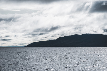 Panoramic view of the rocky shores of Tarbert under dramatic sky. Scotland, UK. Travel destinations,...