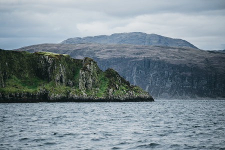 Sailing near the rocky shores (cliffs) of the west coast of Jura island, a view from the yacht....