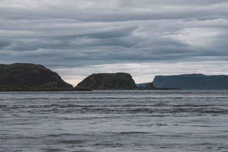 Sailing near the rocky shores (cliffs) of the west coast of Jura island, a view from the yacht....