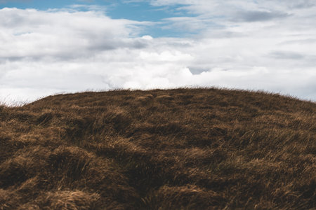 Panoramic view of the shores, hills and valleys of Jura island. Cloudy blue sky. Stormy weather. Paps of Jura, Inner Hebrides, Scotland, UK. Travel destinations, eco tourism, national landmarksの写真素材