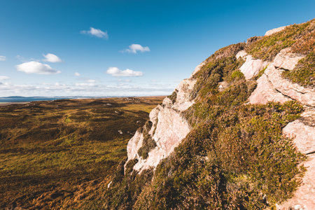 Panoramic view of the valleys hills and rocky shores of Isle of Islay. Inner Hebrides, Scotland, UK. Idyllic landscape. Travel destinations, national landmark, recreation, environmental conservationの写真素材