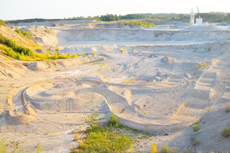 Panoramic view of the quarry on a clear day. Sandy peaks and sand texture close-up. Environmental...