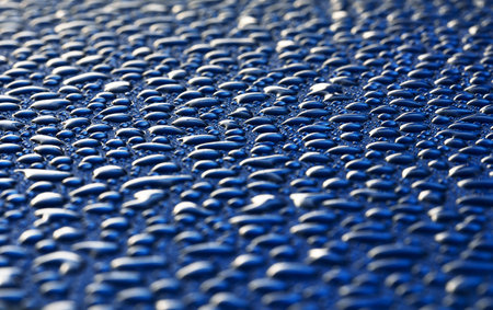 Dark blue background, crystal clear water drops (raindrops). Abstract natural pattern, wallpaper, concept art. Glittering paint texture. Graphic resources, design, 3D, decoration, macro photographyの写真素材