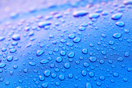Bright blue background, crystal clear water drops (raindrops). Abstract natural pattern, wallpaper, concept art. Pink and purple gradient. Graphic resources, design, 3D, macro photography, decorationの写真素材