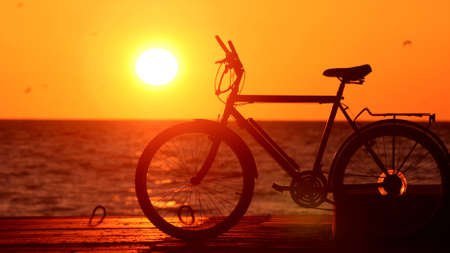bike silhouette at the sunset near sea