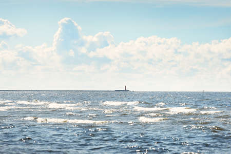 Panoramic view of Baltic sea from sandy shore (sand dunes). Dramatic sky with glowing cumulus...