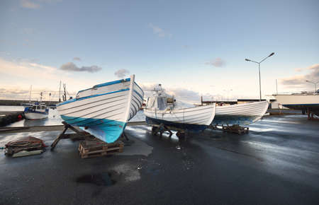 Winterized yacht and boats standing on land, close-up. Waiting for the new sailing season. Yacht club (marina). North sea, Norway. Nautical vessel, service, transportation, leisure activityの写真素材