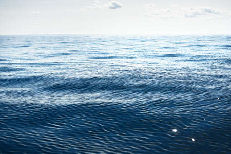 Panoramic view of the North sea from a sailing boat. Cloudy blue sky, reflections in the water....