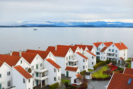Panoramic aerial view of the yacht marina, modern traditional houses with tiled roofs, falu red dye. Stavanger, Rogaland region, Norway. Architecture, travel destinations, tourism, sailing, cruiseの写真素材