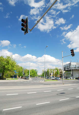 Highway, crossroad, pedestrian walkway, street lights in a city. Cars and buildings. Traffic code,...