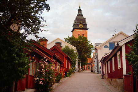 An empty street to the cathedral. Traditional swedish architecture. StrÃ¤ngnÃ¤s, MÃ¤laren...