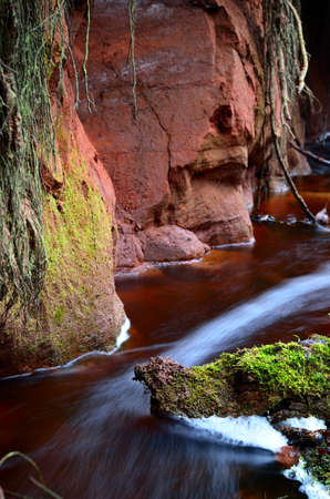 small river scene among rocky valleyの写真素材