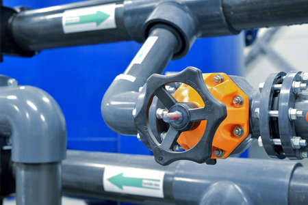 new plastic pipes and colorful equipment in industrial boiler roomの写真素材