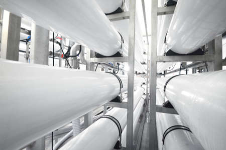 Large industrial water treatment and boiler room. White osmosis pipes.の写真素材