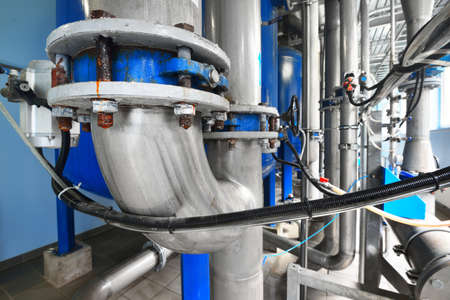 Large industrial water treatment and boiler room. Close-up of valves with servo