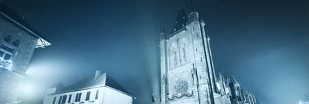 Panoramic view (cityscape) of illuminated empty street in Alsace, France. Atmospheric urban scene....