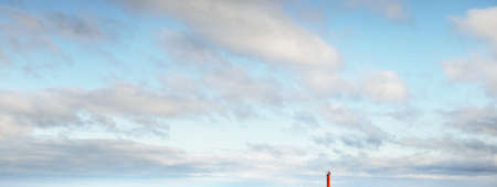 Clear blue sky with glowing clouds after storm at sunset. Soft sunlight. Dramatic cloudscape....