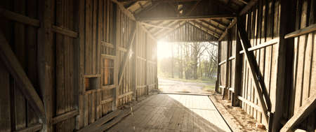 An old abandoned rustic wooden shed, close-up. Agriculture, farm industry, traditional architecture, USA, Wild West, history, gold mine, western, zombie, horror and other graphic resources conceptsの写真素材