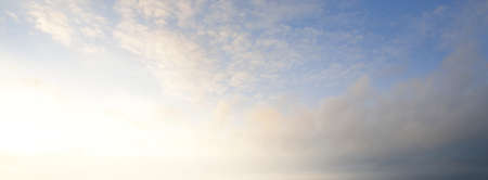 Cloudscape. Clear blue glowing sky. Soft sunlight. Panoramic image, texture, background, graphic...