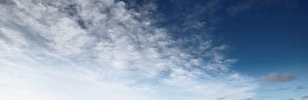 Coudscape. White ornamental clouds. Soft sunlight, sunbeams. Clear blue sky. Natural pattern,...
