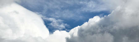 Ornamental clouds. Dramatic sky. Epic storm cloudscape. Soft sunlight. Panoramic image, texture,...
