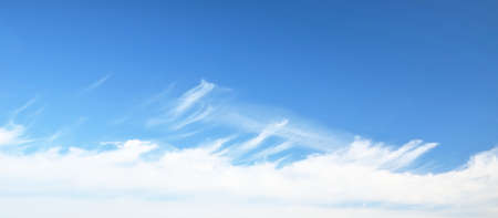 Coudscape. White ornamental clouds. Soft sunlight, sunbeams. Clear blue sky. Natural pattern,...