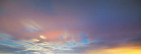 Dark glowing sky after the storm in winter, golden sunlight. Dramatic cloudscape. Ecology, climate...