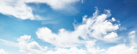 Coudscape. White ornamental clouds. Soft sunlight, sunbeams. Clear blue sky. Natural pattern,...