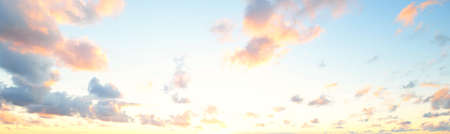Clear sky with glowing pink cumulus clouds above the Baltic sea shore after thunderstorm at sunset....