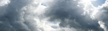 Ornamental clouds. Dramatic sky. Epic storm cloudscape. Soft sunlight. Panoramic image, texture,...