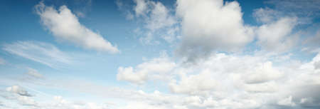 Ornamental clouds. Dramatic sky. Epic storm cloudscape. Soft sunlight. Panoramic image, texture,...