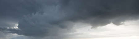 Ornamental clouds. Dramatic sky. Epic storm cloudscape. Soft sunlight. Panoramic image, texture,...