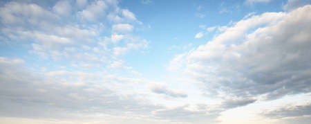 Ornamental clouds. Dramatic sky. Epic storm cloudscape. Soft sunlight. Panoramic image, texture,...