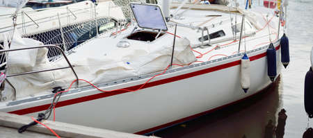 32 feet swedish built cruising sailboat moored to a pier in a yacht marina. StrÃ¤ngnÃ¤s, MÃ¤laren lake, Sweden. Summer vacations, tourism, cruise, recreation, sport, leisure activity, regatta, lifestyleの写真素材